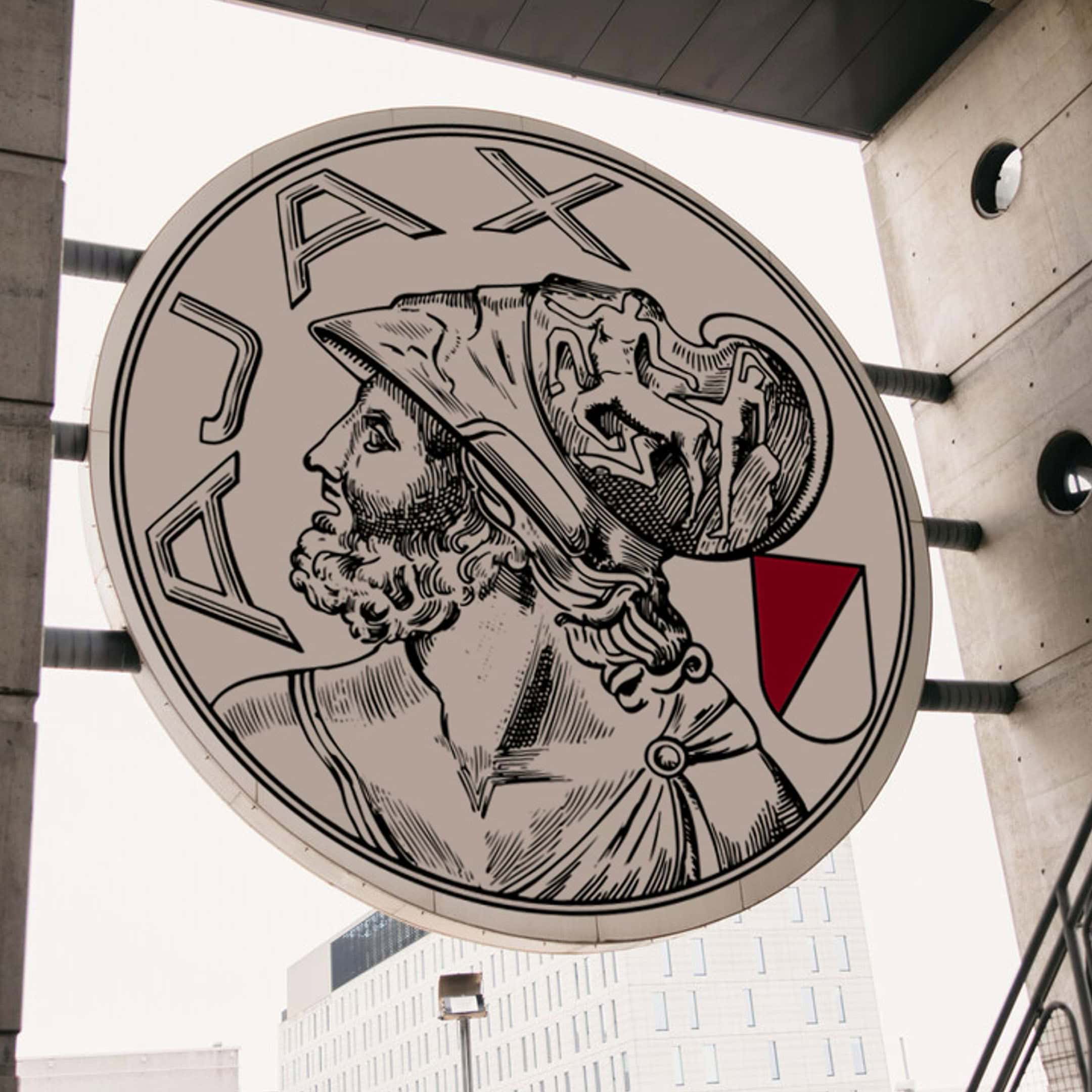 A detailed vintage logo of Axa, showcasing a Roman soldier's profile with a helmet, mounted on a building exterior, blending classical design with contemporary architecture.