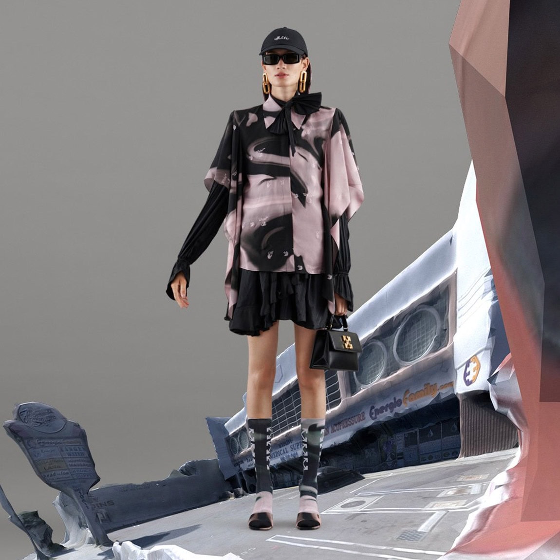 Fashion model wearing a stylish oversized jacket, black skirt, and accessories, standing confidently against a modern, abstract background.